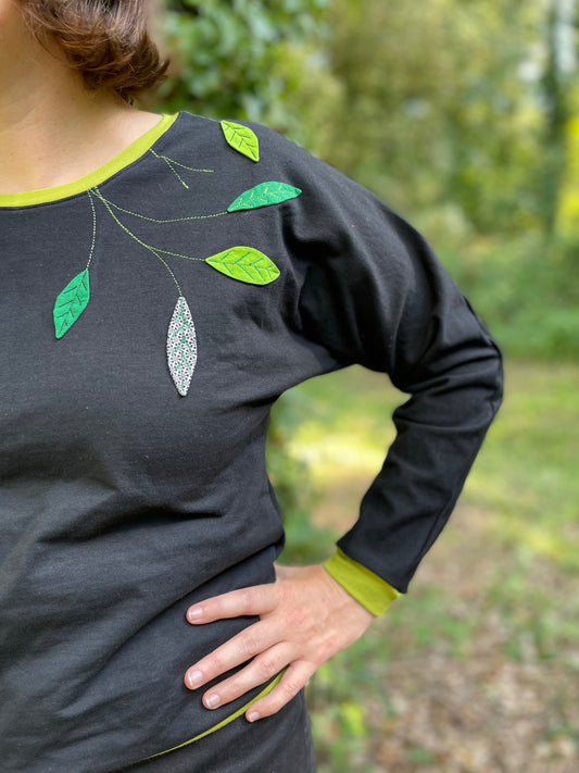 Sweat en molleton noir à feuillages vert