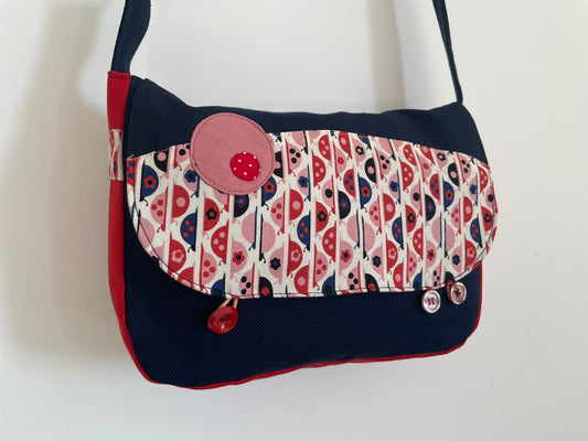 Sac en coton bleu marine et rouge avec des coccinelles